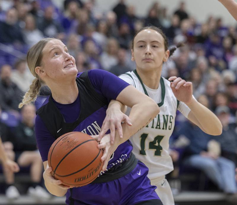 Dixon’s Jessie Pitman is fouled by Boylan’s Mary Rose Friday, Feb. 16, 2024 at the class 3A Rochelle girls basketball regional.