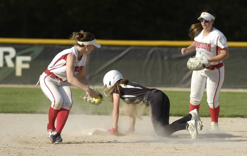 A Rock Falls player slides into second base between Oregon's Ella Dannhorn (left) and Gracen Pitts on Monday, May 6, 2024 in Rock Falls High.