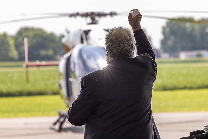 Deacon George Schramm blesses the OSF Life Flight helicopter Wednesday, July 10, 2024 during a dedication/open house for the new hangar in Rock Falls.