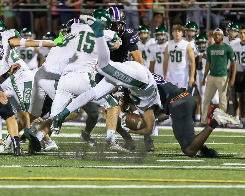 Glenbard West's JaMarcus Kelly (22) is upended on a kickoff return during a football game between Glenbard West at Downers Grove North on Friday, Sept 13th, 2024  in Downers Grove.