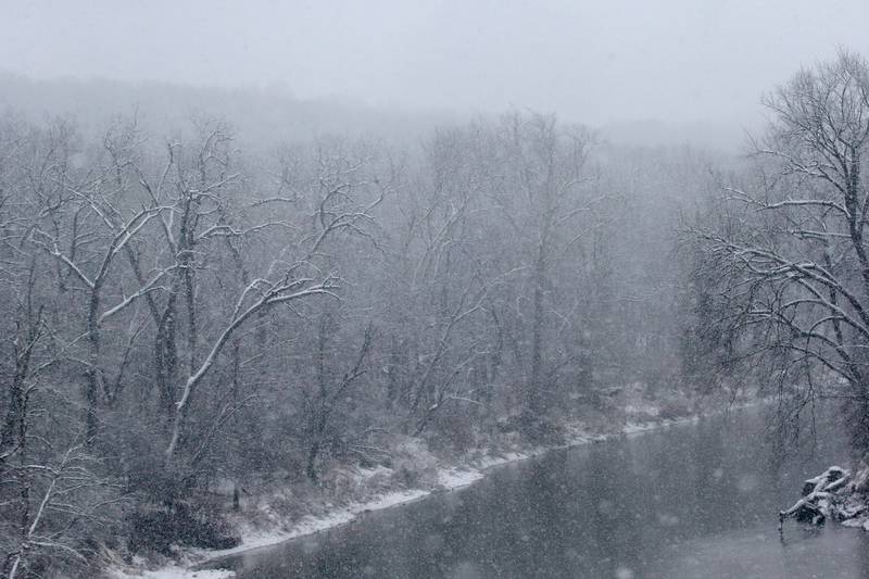 Heavy snow falls on the Vermilion River on Tuesday, Jan. 9, 2024 near Oglesby.