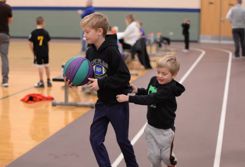 (left) Colin Hamari of LaGrange keeps the ball from his brother Liam during Youth Basketball at the LaGrange Park District Saturday, Jan 6, 2024.