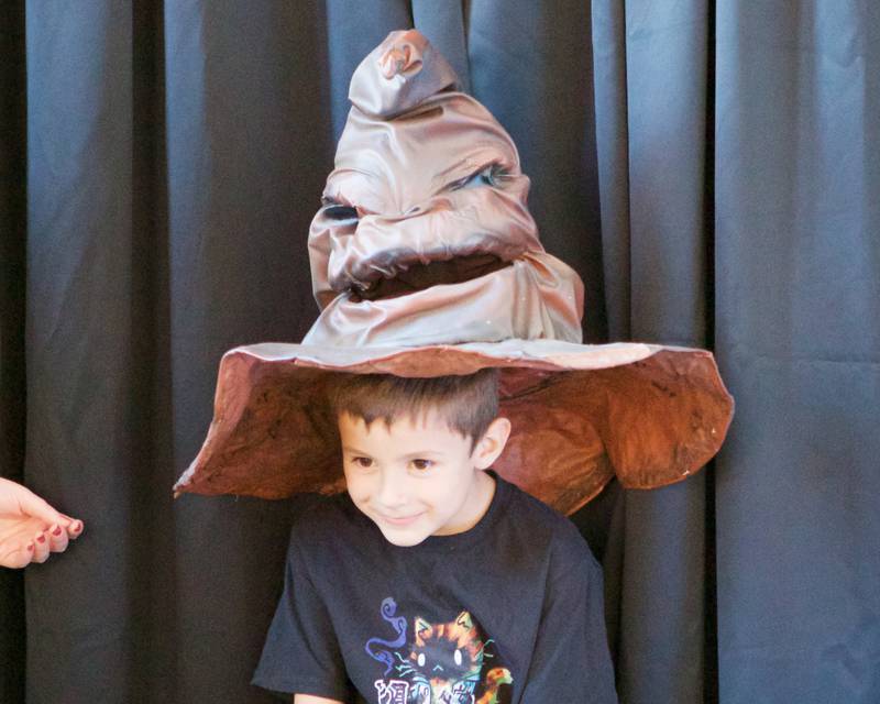 Owen Vazquez age 6 of Woodstock wears the talking hat at the Witches and Wizards of Woodstock on Sunday, Oct. 20,2024 in Woodstock.