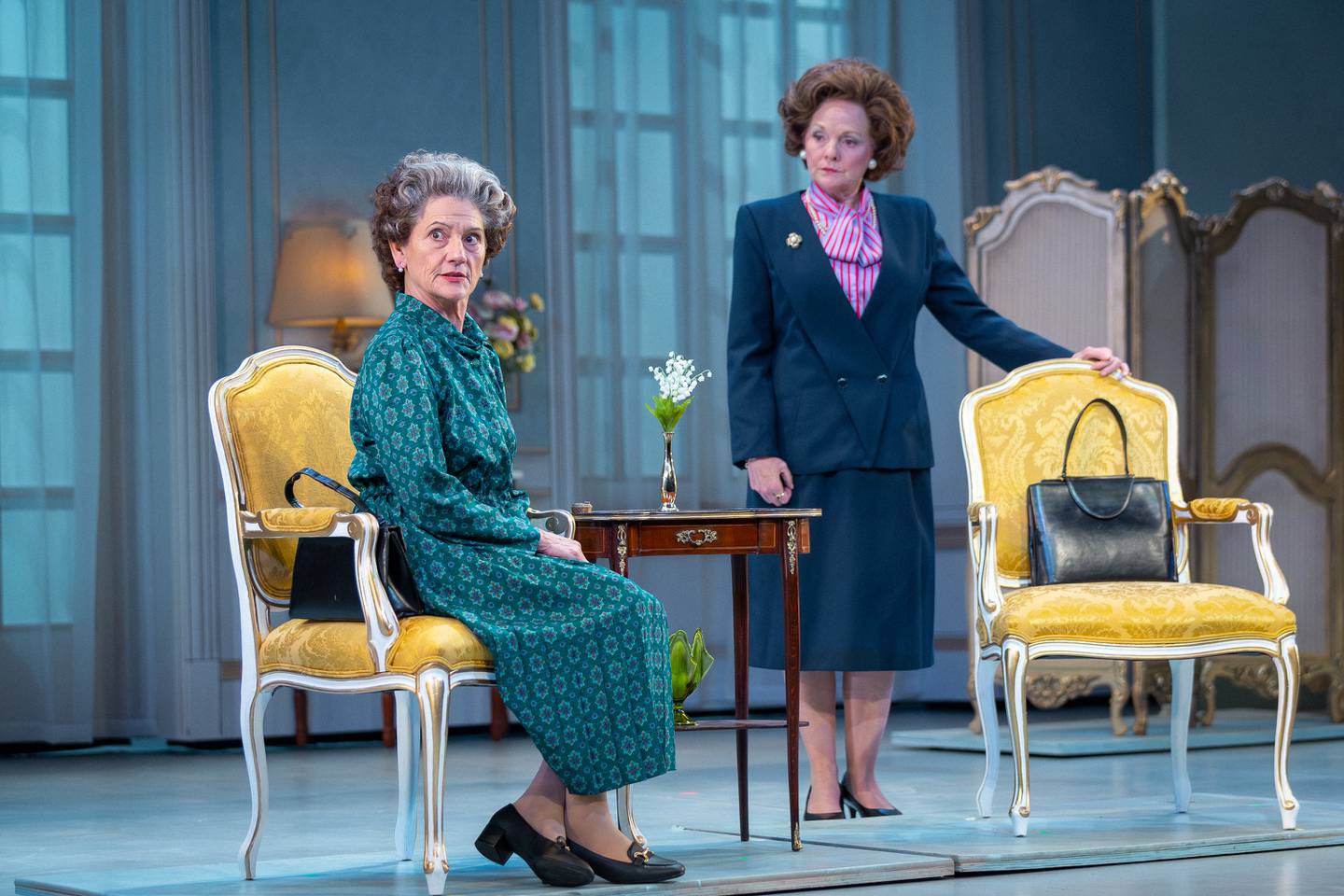 Janet Ulrich Brooks as Queen Elizabeth II and Susie McMonagle as Prime Minister Margaret Thatcher in "The Audience" at Drury Lane Theatre in Oakbrook Terrace in 2024.