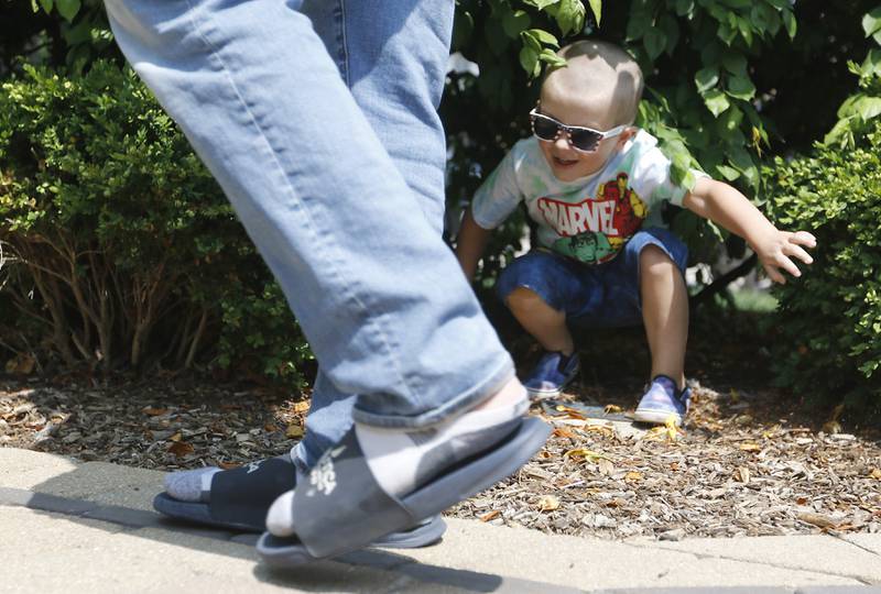 Jackson Graff, 4, tells his father, Ryan, that he missed finding him on Wednesday, June 7, 2023, while playing hide-and-seek with his father and sister, Madison, 2, around the gazebo in Huntley.