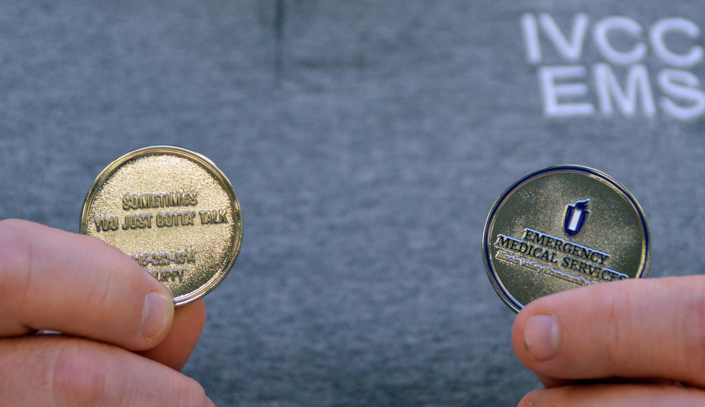 One side of the coins features the Illinois Valley Community College and program logo and the flip side includes Chaplain Dave Van Laar’s contact information.