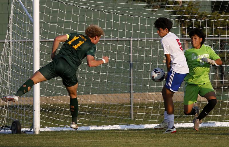 Crystal Lake South's Mason Ross watches  as the ball he directed toward the goal hits Dundee-Crown's Alex Beltran and goes into the goal during a Fox Valley Conference soccer match on Tuesday, Sept. 10, 2024, at Crystal Lake South High School.