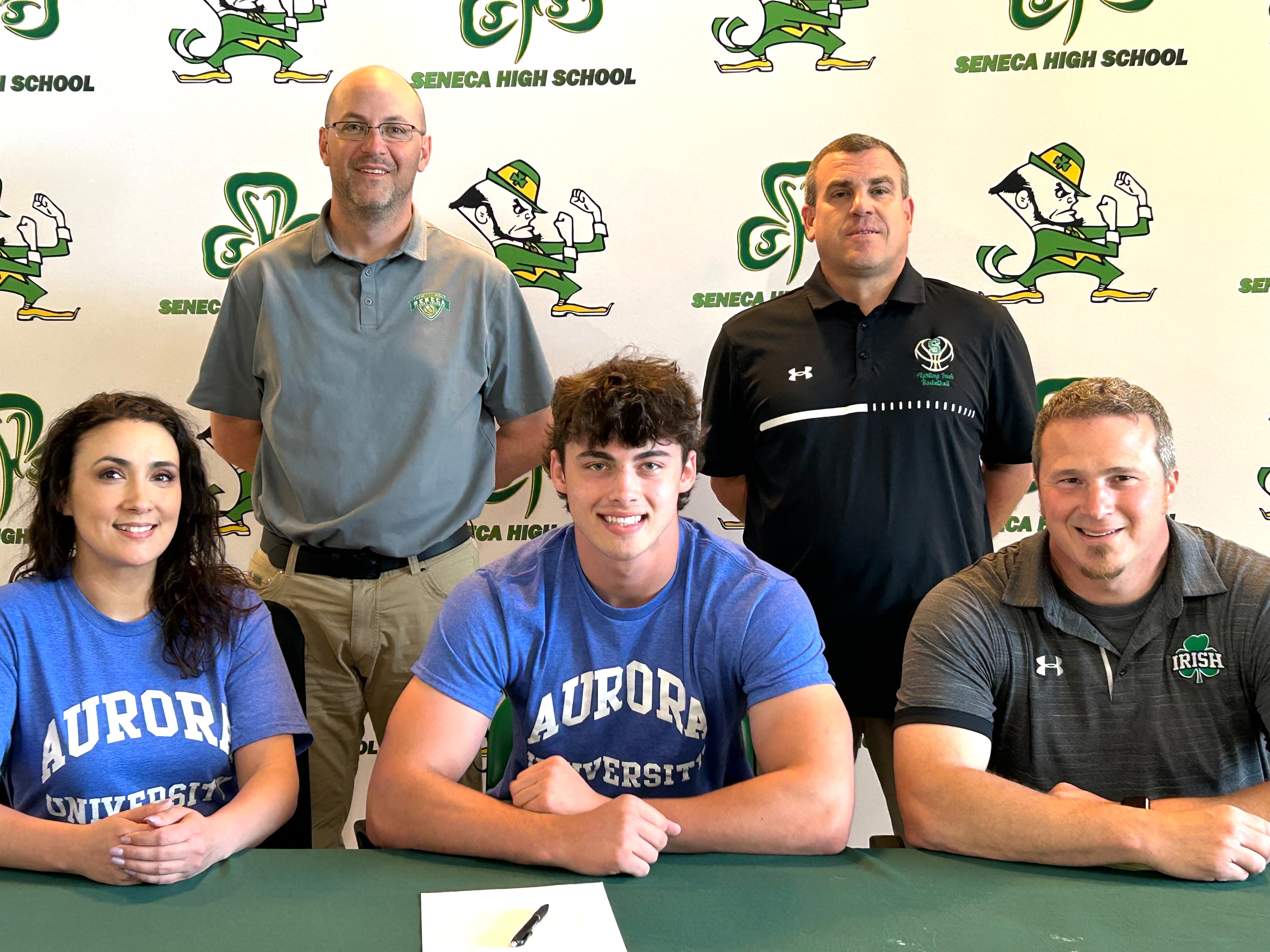 Seneca’s Kysen Klinker has signed to continue his education in-state at Aurora University and his football career at the NCAA Division III level with the Spartans. Klinker, a standout tight end/linebacker for the Fighting Irish and second-team member of the 2023 Times All-Area Football Team, is pictured here at his signing ceremony. From the left are: in front – Tara Castleberry, Kysen Klinker and Terry Maxwell; in back – Levi Derber and Ted O’Boyle.