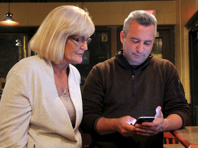 Mary Jaworski, Executive Vice President for the Joliet Chamber of Commerce (left) and 
Ted Brodeur of the Joliet Park District, anxiously await early election returns.