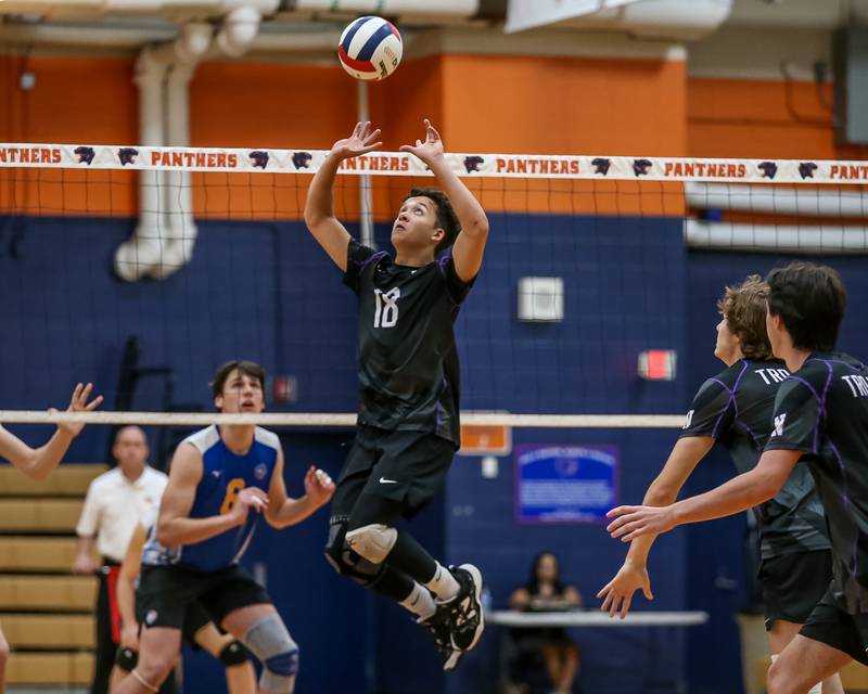 Downers Grove North's Grant Henderson (18) sets a shot during Oswego Sectional final between Downers Grove North at Lyons.  May 30, 2023.