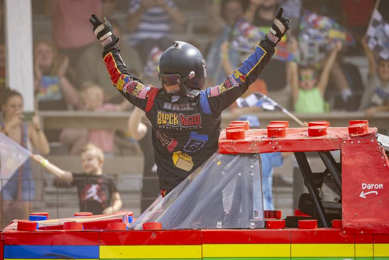 Daran Basil, the driver of Block Head, celebrates his victory Saturday, July 20, 2024, in the freestyle portion of the Overdrive Monster Truck show at Bureau County Fairgrounds in Princeton.