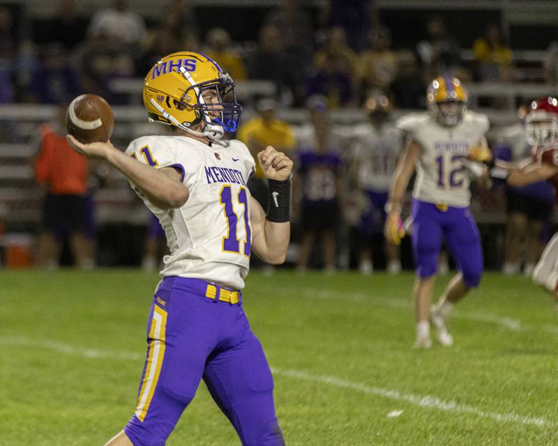 Mendota's Aden Tillman looks for a receiver downfield during the game against Hall High School on September 13, 2024 at Richard Nesti Stadium.