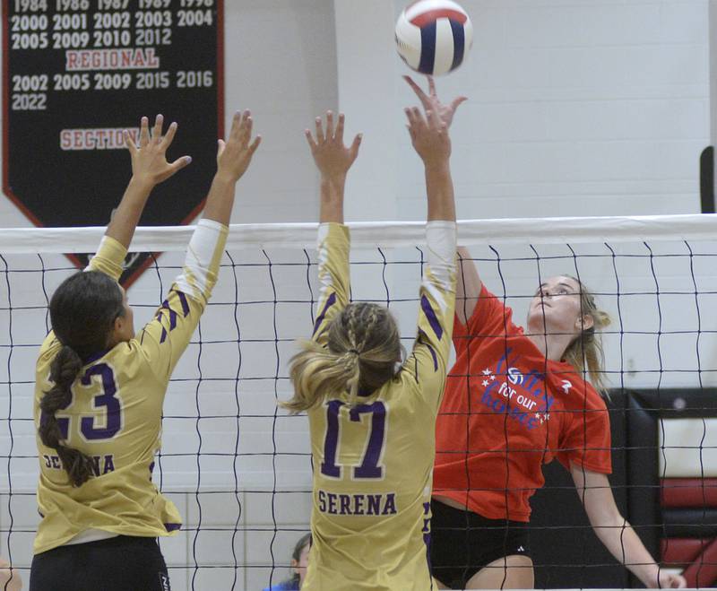 Woodland’s Malayna Pitte (3) rises to attack as Serena’s Paisley Twait (23) and Kendall Whiteaker (17) rise to block during the first set Tuesday, Sept. 5, 2023, in rural Streator.