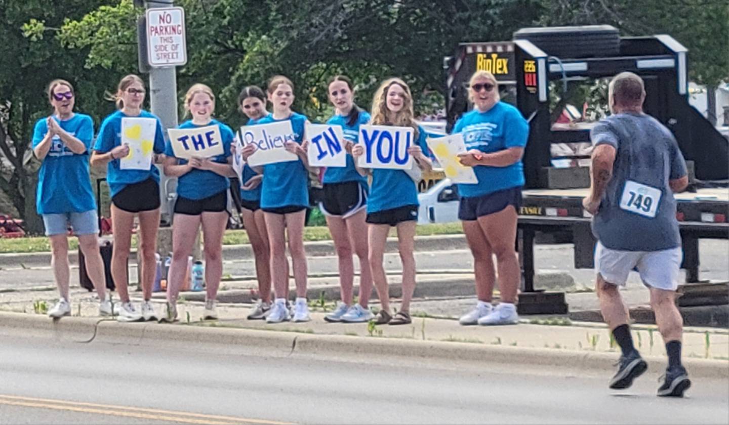 Volunteers encourage the participants of Saturday's Run Today For Tomorrow 5K run/walk for suicide awareness held on Ottawa's riverfront.