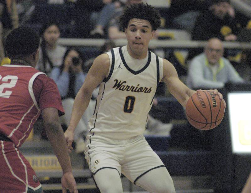 Sterling'sAndre Klaver faces off against Ottawa's Tristan Finley during Sterling’s 3A Regional semifinal game Wednesday, Feb. 21, 2024, at Sterling High School.