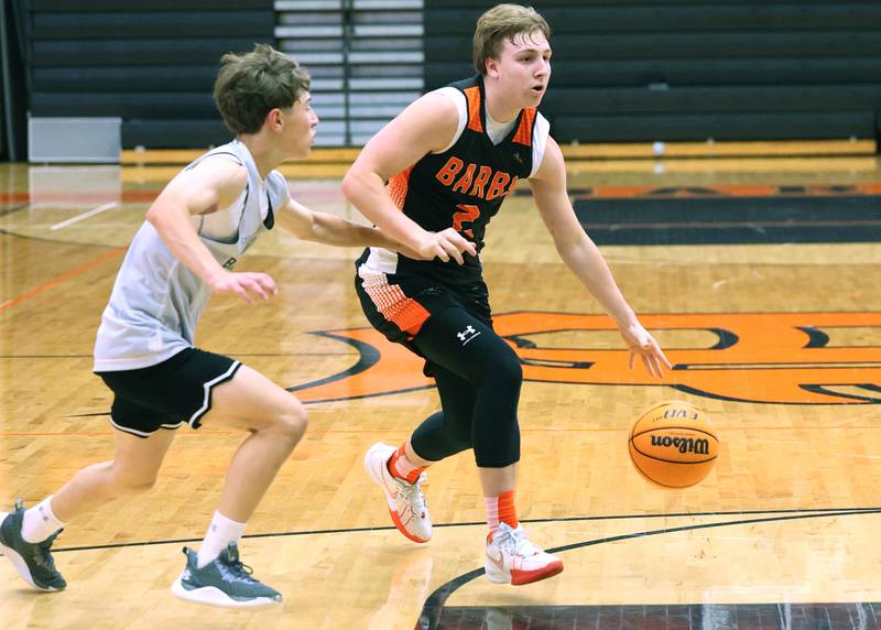 DeKalb’s Sean Reynolds drives by a defender during their summer game against Elk Grove Tuesday, June 18, 2024, at DeKalb High School.