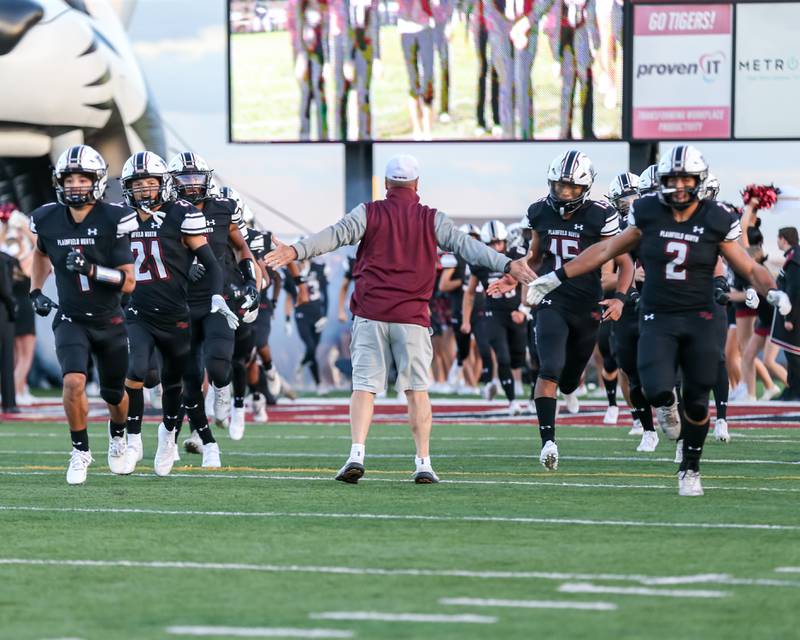 Plainfield North runs out on the field before a football game between York at Plainfield North on Friday, Sept 6th, 2024 in Plainfield. Gary E Duncan Sr for Shaw Local News Network.