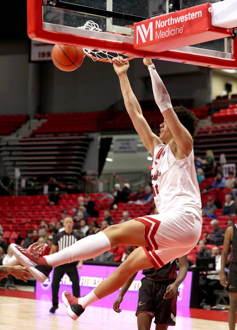 Northern Illinois' Yanic Konan Niederhauser dunks the ball during their game against Calumet Monday, Dec. 18, 2023, at the Convocation Center at NIU in DeKalb.