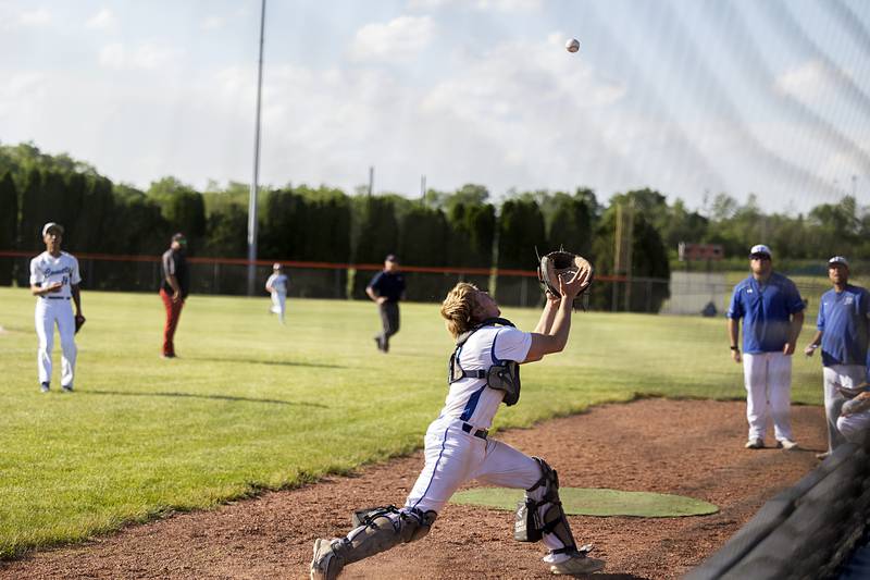 Newman’s Daniel Kelly goes to the netting to catch a pop-up against Stillman Valley Wednesday, May 22, 2024 in the Class 2A sectional semifinal in Byron.