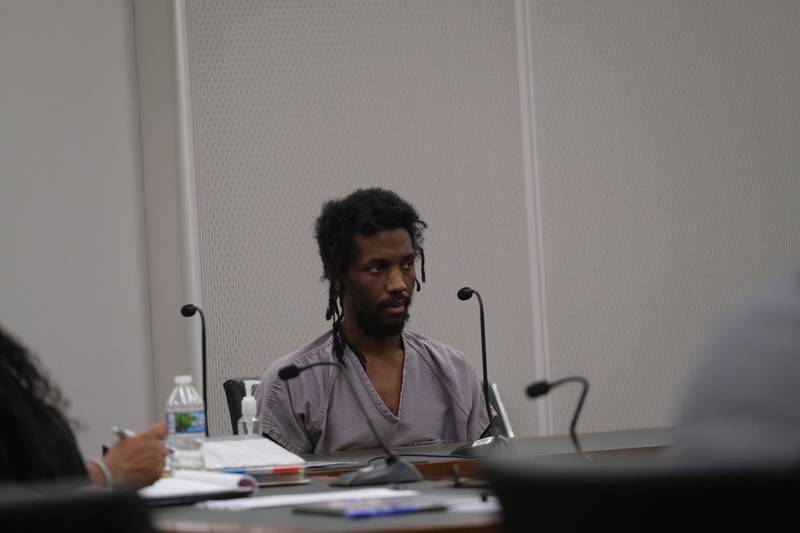 Robert Watson, 29, listens to closing arguments on Thursday, May 11, 2023, in his trial at the Will County Courthouse. Watson is charged with the murder of Emanuel Burgarino, 76, on March 24, 2019, at the Harrah's casino hotel in Joliet.