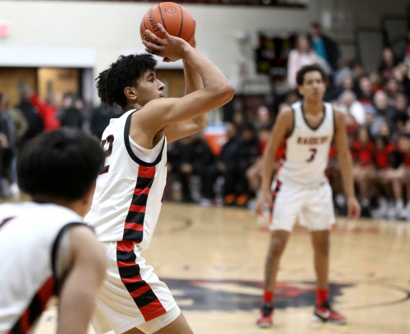 Bolingbrook’s J.T. Pettigrew shoots the ball during the Class 4A East Aurora Boys Basketball Sectional final against Downers Grove North on Friday, March 1, 2024.