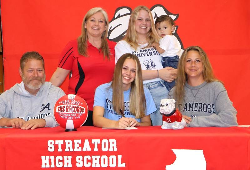 Streator’s Rilee Talty has signed to continue her education at St. Ambrose University in Davenport, Iowa, and her volleyball career at the NAIA level with the Fighting Bees. Talty, a defensive specialist who earned second-team accolades to the 2023 Times All-Area Girls Volleyball Team, is pictured (front, center) at her signing ceremony surrounded by family and Streator volleyball coach Julie Gabehart (back, left).