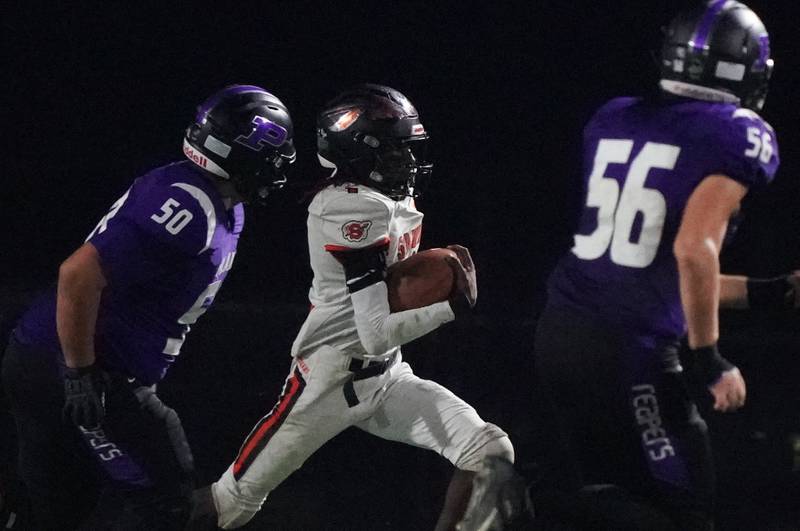 Sandwich's Simeion Harris (1) runs back an interception against Plano during a football game at Plano High School on Friday, Sep 13, 2024.