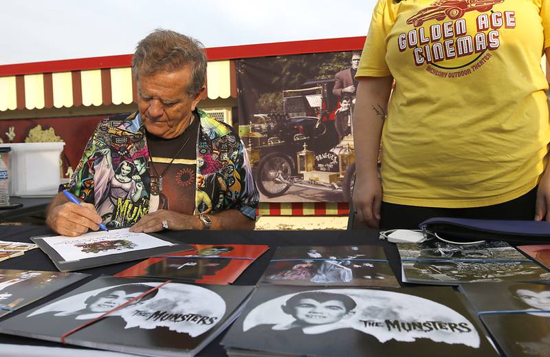 Butch Patrick, who played Eddie Munster on the 1960s show “The Munsters” signs autographs, Wednesday, Aug. 14, 2024, during an appearance at the McHenry Outdoor Theater.