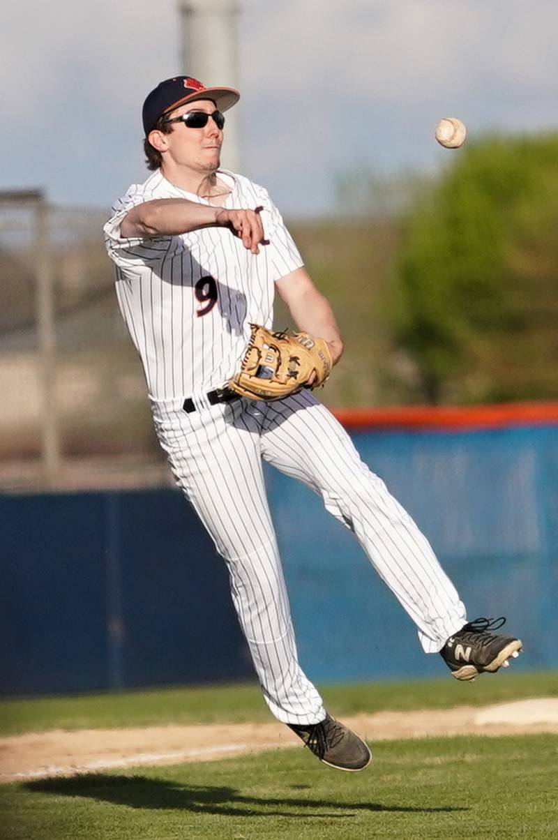 Oswego’s Anthony Comperda (9) fields a grounder and throws to first for an out against Yorkville during a baseball game at Oswego High School on Monday, April 29, 2024.