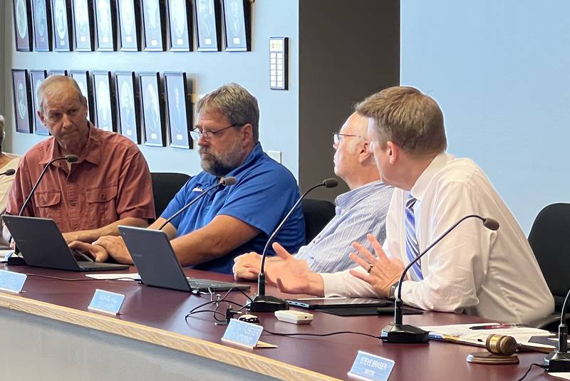 Sycamore 1st Ward Alderman Alan Bauer, sitting next to 2nd Ward Aldermen Pete Paulsen and Chuck Stowe, asks City Manager Michael Hall a question during a City Council meeting on June 17, 2024.