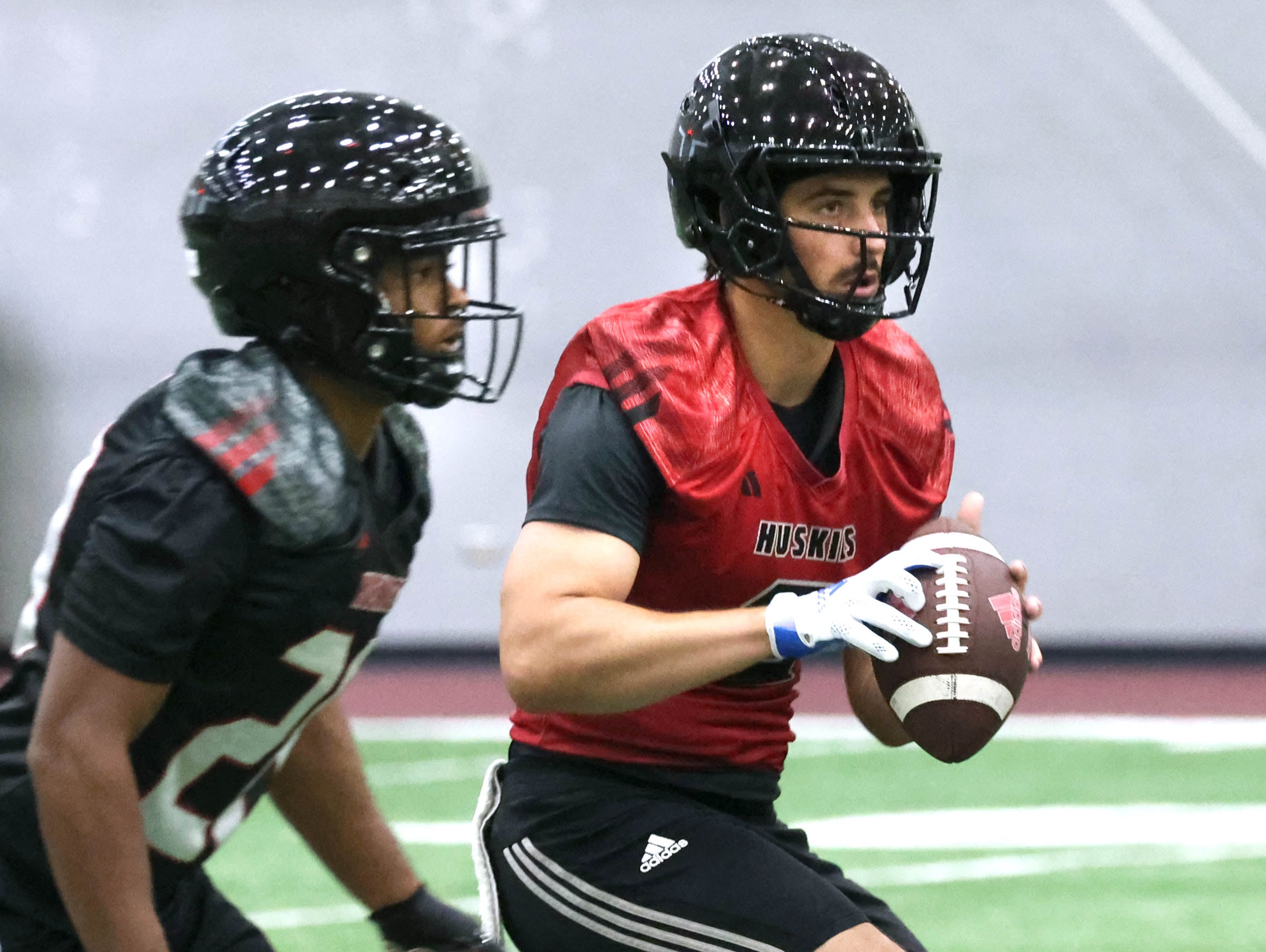 Northern Illinois University quarterback Ethan Hampton takes a snap during a July 2024 practice in the Chessick Practice Center at NIU.