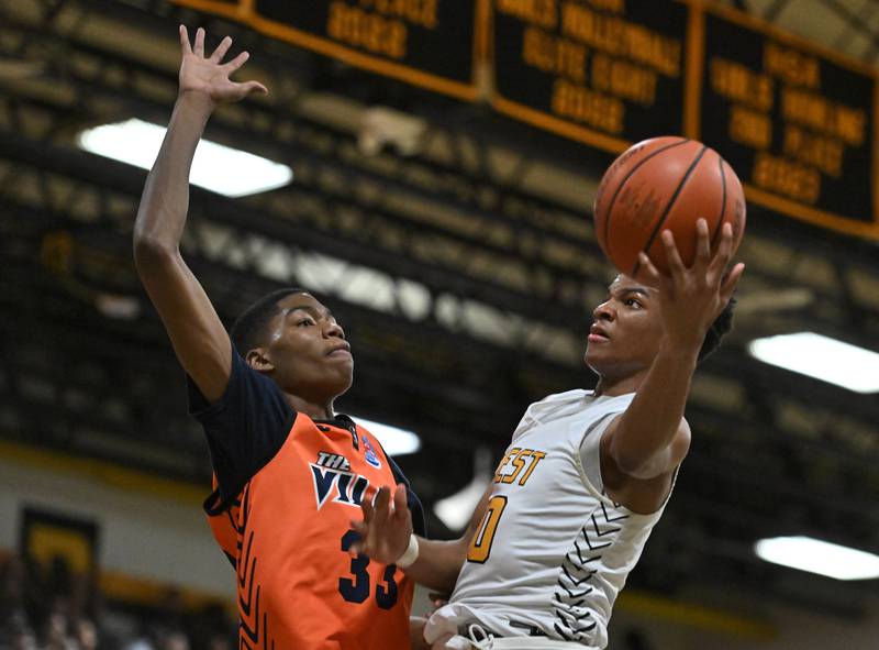 Joliet West's Zion Gross goes up for a shot during a conference game against Romeoville on Friday, Feb. 02, 2024, at Joliet. (Dean Reid for Shaw Local News Network)