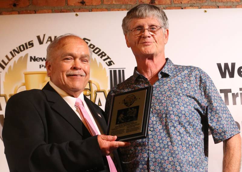 Pat Beals son of coach Bob Beals smiles with Rick Sipovic after receiving an award for his father during the Illinois Valley Sports Hall of Fame awards banquet on Thursday, June 6, 2024 at the Auditorium Ballroom in La Salle.