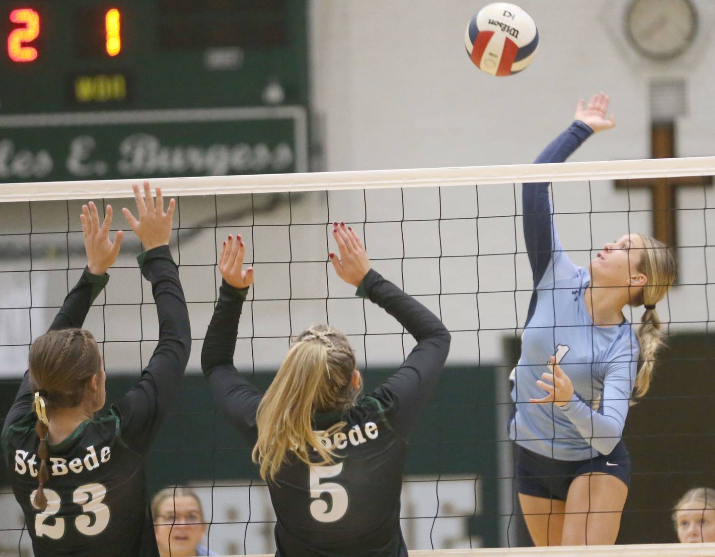 Bureau Valley's Kinley Canady spikes the ball past St. Bede's Mary Quinn McClain and teammate Emma Smudzinski on Monday, Sept. 9, 2024 at St. Bede Academy.