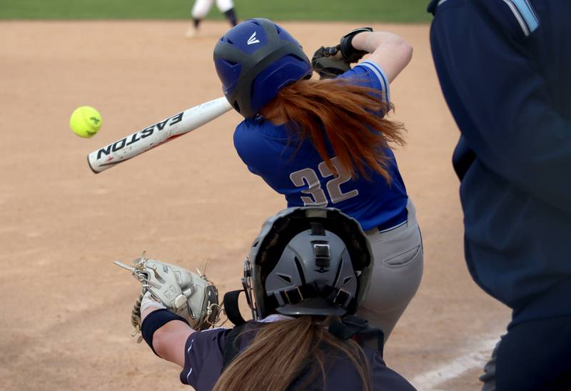 Burlington Central’s Allie Botkin makes contact in varsity softball at Cary Monday.