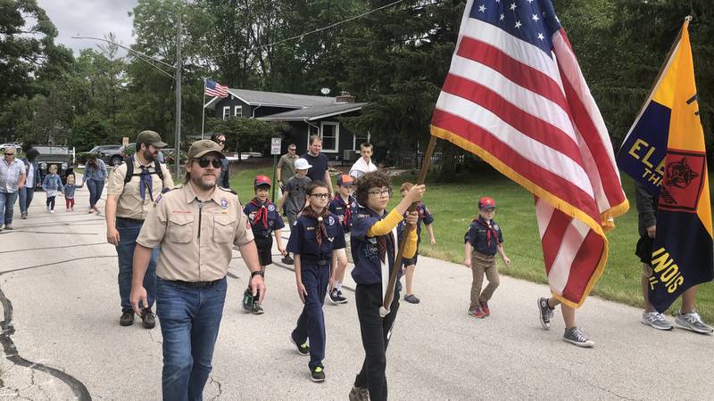 Scouts from Elburn's Boy Scout Troop 7 march in the Memorial Day Parade from Lions Park to Blackberry Township Cemetery.