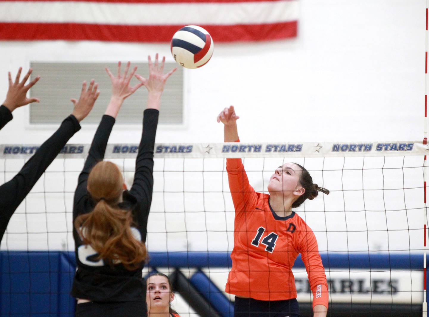 Oswego’s Mia Jurkovic (14) goes up for a kill during a game Wednesday, Sept. 18, 2024 at St. Charles North.