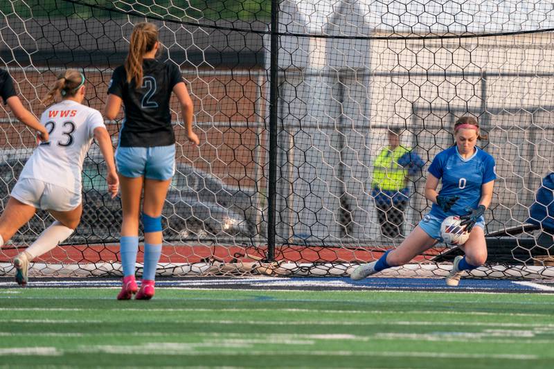 St. Charles North players and coaches pose for pictures after winning the Class 3A girls soccer regional final against Wheaton Warrenville South at St. Charles North High School on Friday, May 19, 2023.