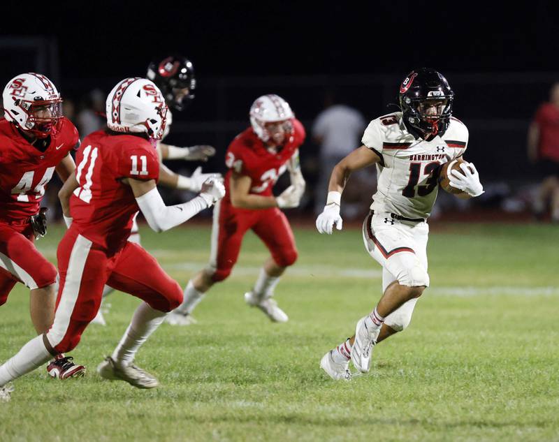 Barrington's Jacob Dorn (13) moves the ball upfield Friday, Aug. 30, 2024 in South Elgin.