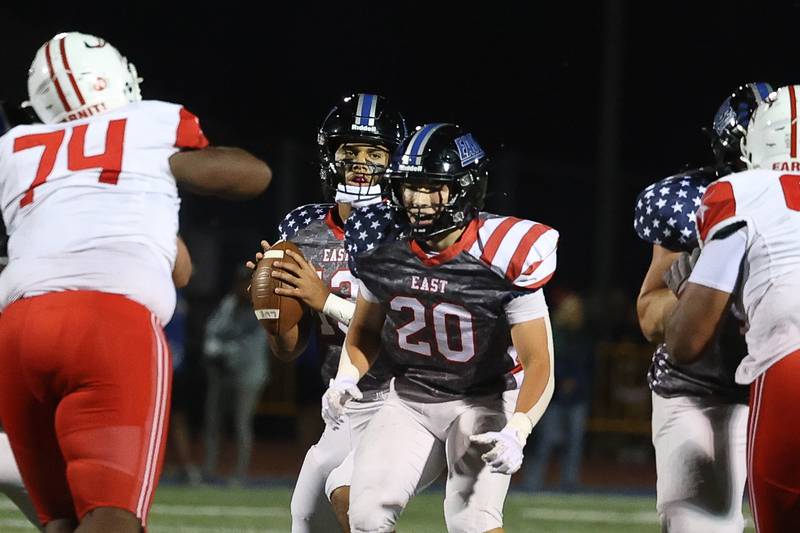 Lincoln-Way East’s Brody Gish blocks as Jonas Williams looks to pass against Homewood-Flossmoor on Friday, Sept. 27, 2024 in Frankfort.