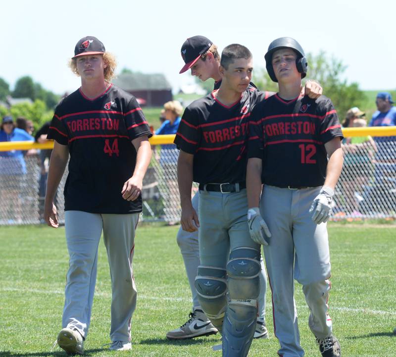 Forreston catcher Mikey Probst consoles Darin Greenfield after the Cardinals walk back to their dugout after losing to East Dubuque in the championship game of the 1A  Forrestion Sectional on Saturday, May 25, 2024 at Forreston High School. Also pitcured is Ethan Bocker (44)  and Brendan Greenfield, East Dubuque scored two runs in the top of the seventh inning to edge the Cardinals 4-3 and move on to the supersectional.