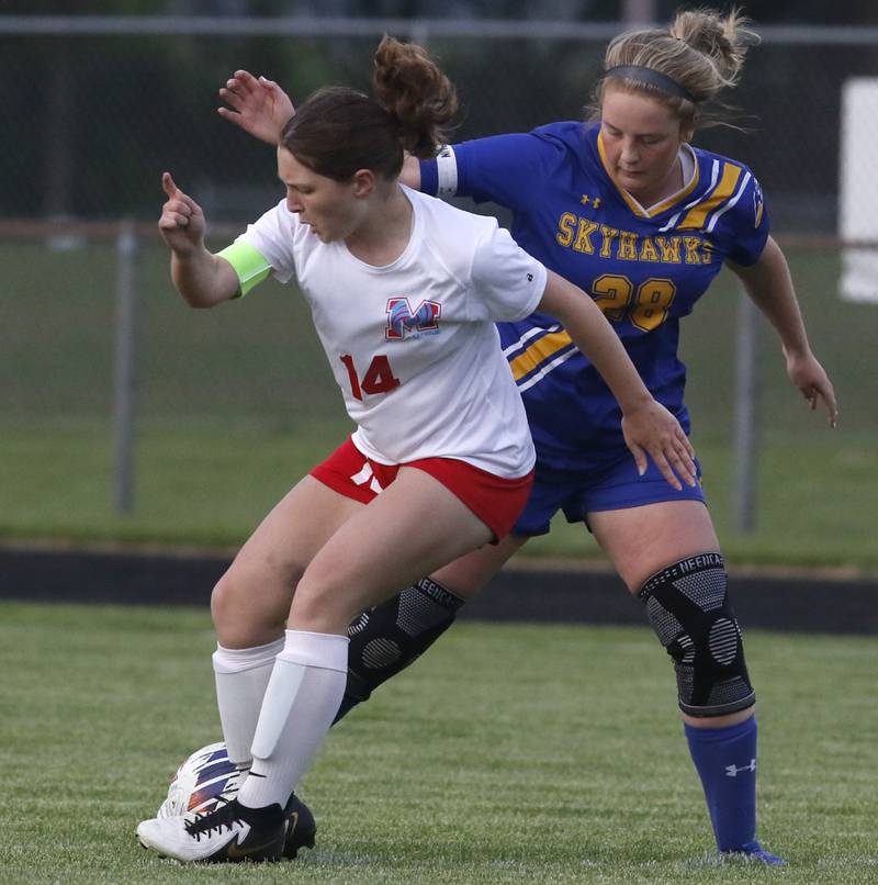 Marian Central'a Knapp Mia battles with Johnsburg's Mackenzie McQuiston for control of the ball during the IHSA Class 1A Marengo Regional championship soccer match on Tuesday, May 14, 2024, at Marengo High School.