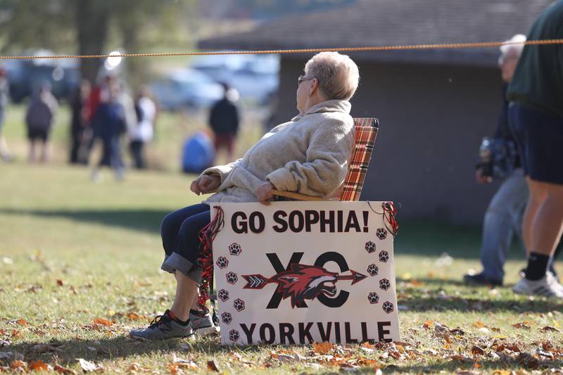 Judy Keeler waits for her granddaughter, Sophia Keeler, near the finish line at the Girls Cross Country Class 3A Minooka Regional at Channahon Community Park on Saturday.
