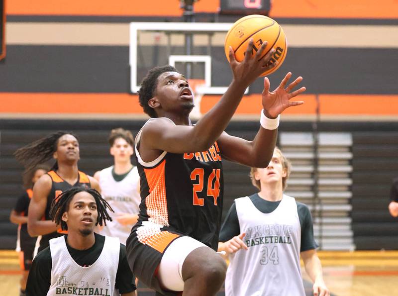 DeKalb’s Myles Newman goes to the basket during their summer game against Elk Grove Tuesday, June 18, 2024, at DeKalb High School.