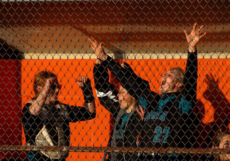 Woodstock North’s Thunder make some noise late in an extra-inning win in varsity softball at Crystal Lake Central Friday.