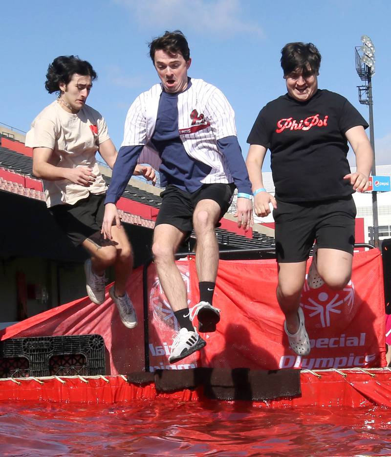 Members of the Phi Kappa Psi fraternity jump into the water on a cold and windy Saturday, Feb 17, 2024, during the Huskie Stadium Polar Plunge at Northern Illinois University in DeKalb. The Polar Plunge is the signature fundraiser for Special Olympics Illinois.