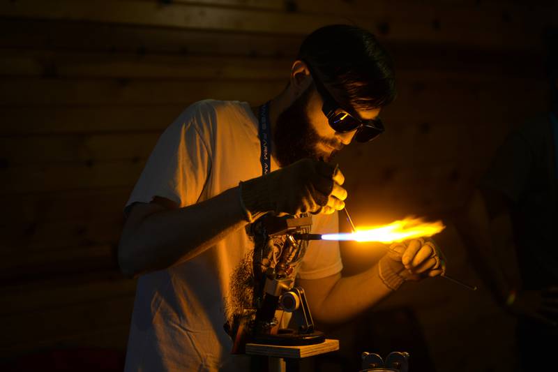 Joe Wallander of Glendale Heights makes a trinket out of glass during "Cannafest" at Elks Page Park, north of Dixon, on Saturday, July 8. The event was hosted by Herbal Essentials, a downtown Dixon business with some proceeds benefiting Rosbrook Studios.