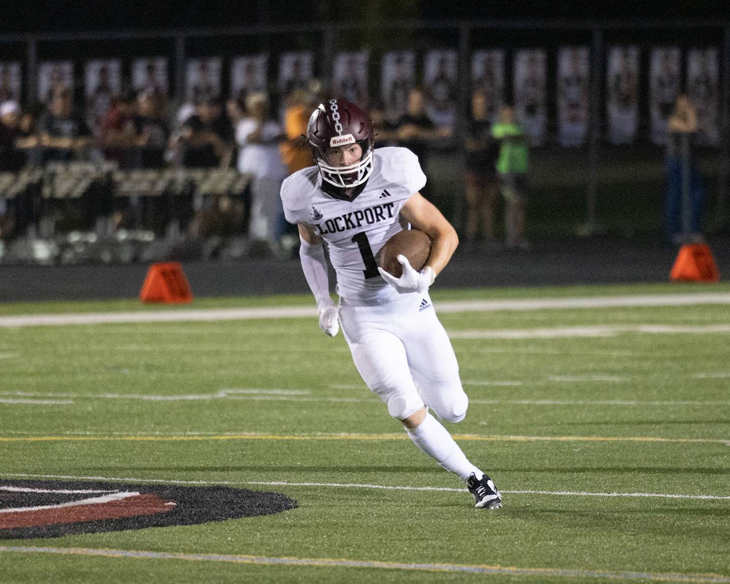 Lockport’s Tanner Benaitis runs upfield after a catch against Plainfield North on Friday, Aug. 25, 2023 in Plainfield.