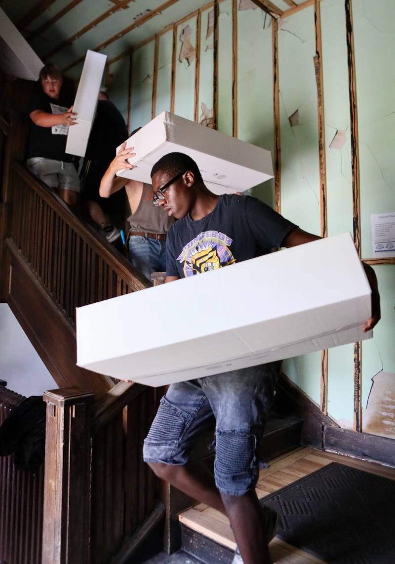 PHS freshman Michael Butler helped move boxes from the third floor of the Sash Stalter Matson Building to the basement in a matter of 15 minutes for the Bureau County Historical Society.