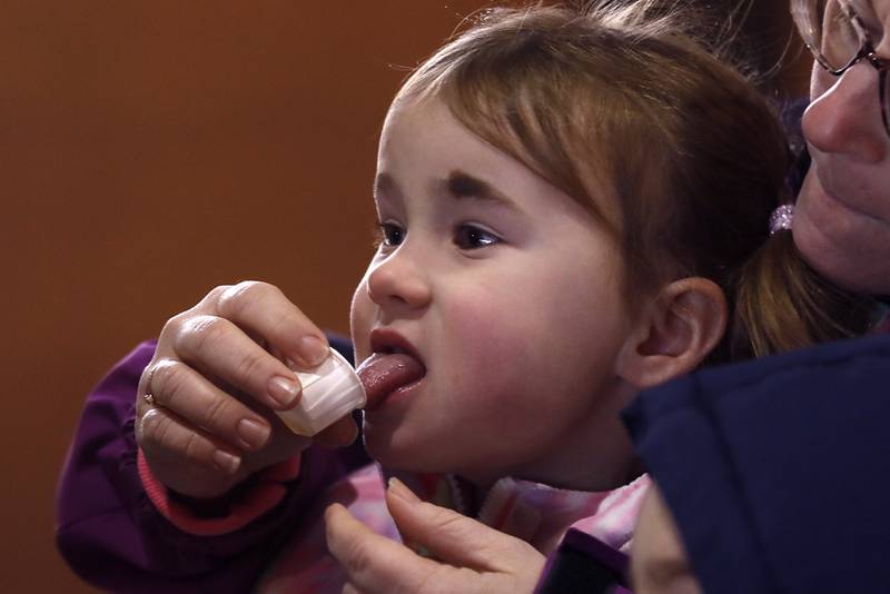 Mary Grace Wells,4, tastes maple syrup during a maple syrup tasting during the McHenry County Conservation District’s annual Festival of the Sugar Maples, at Coral Woods Conservation Area, in Marengo, on Monday, March 11, 2024.